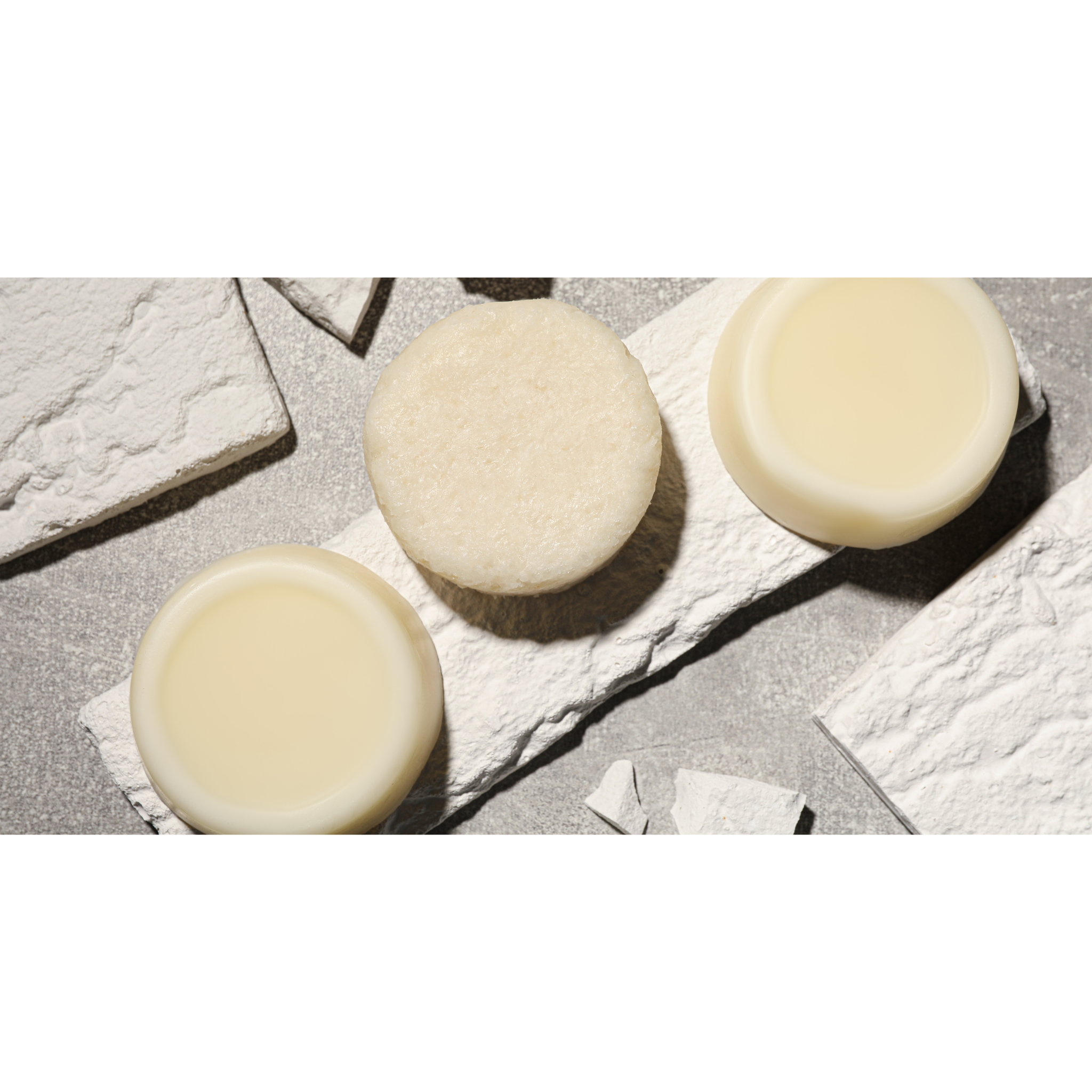 Celtic Clan Soapery ph Balanced Cleansing Bars. Three off white bars on stone slab